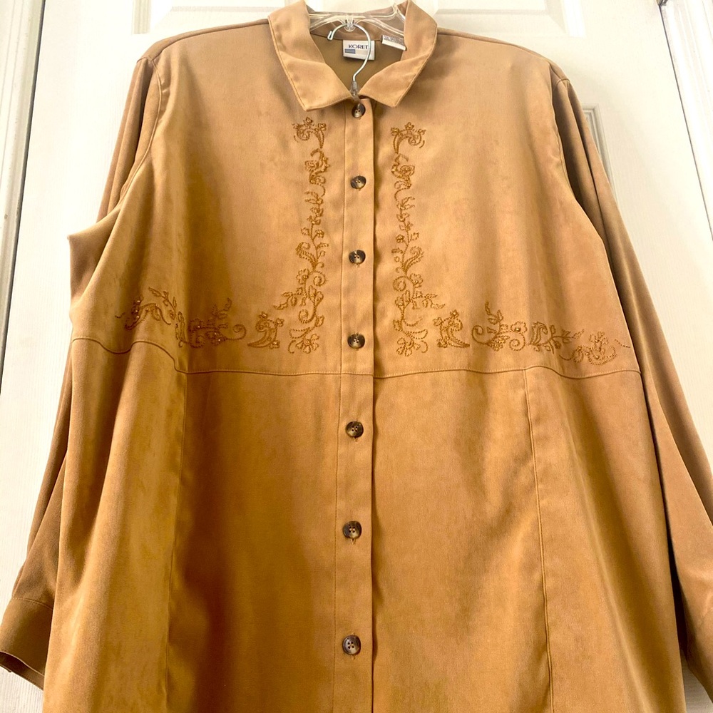 97% polyester 3% spandex beautiful tan piece with vine embroidery. Super Soft